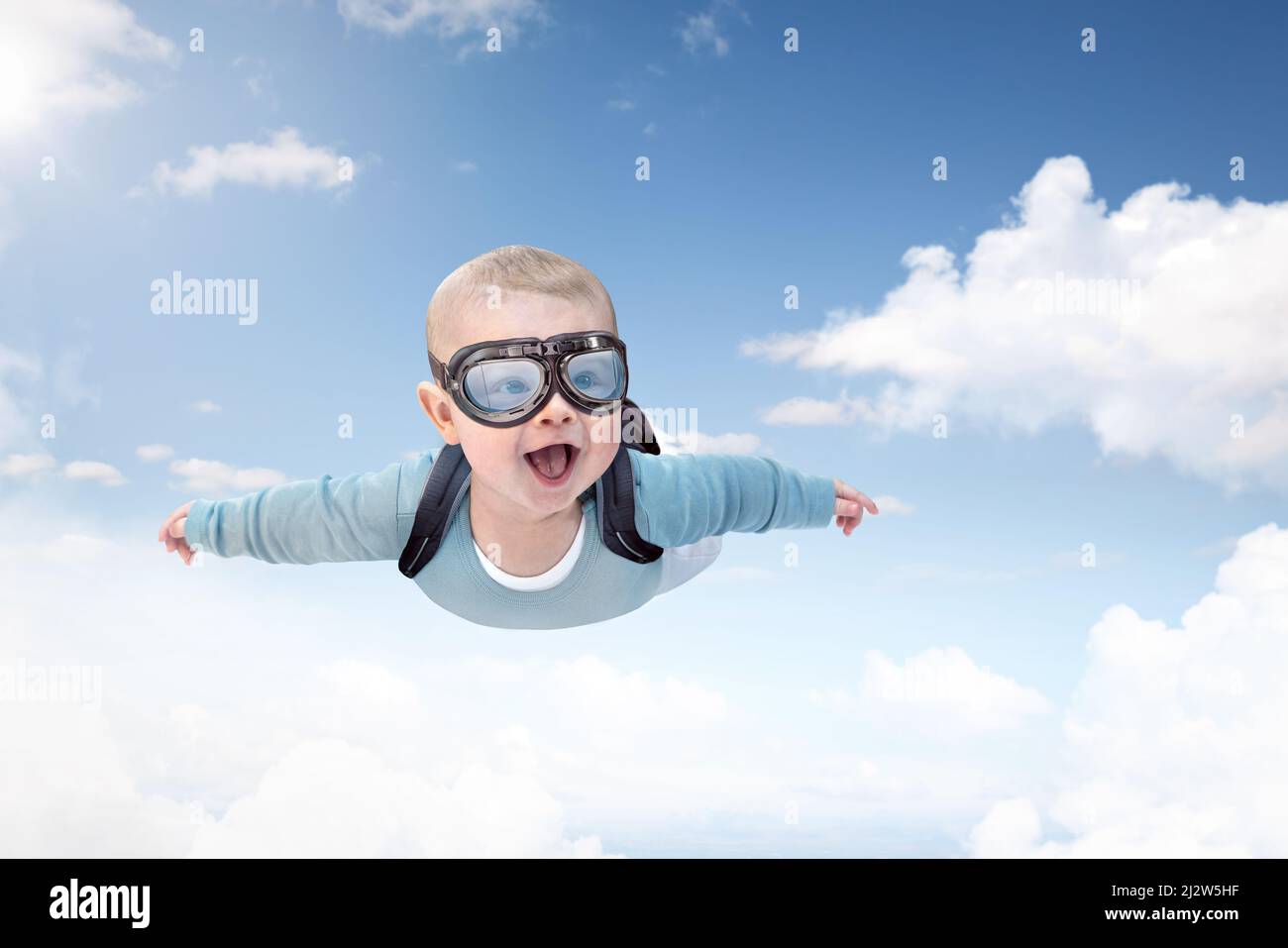 Skydiving baby flying through the sky Stock Photo