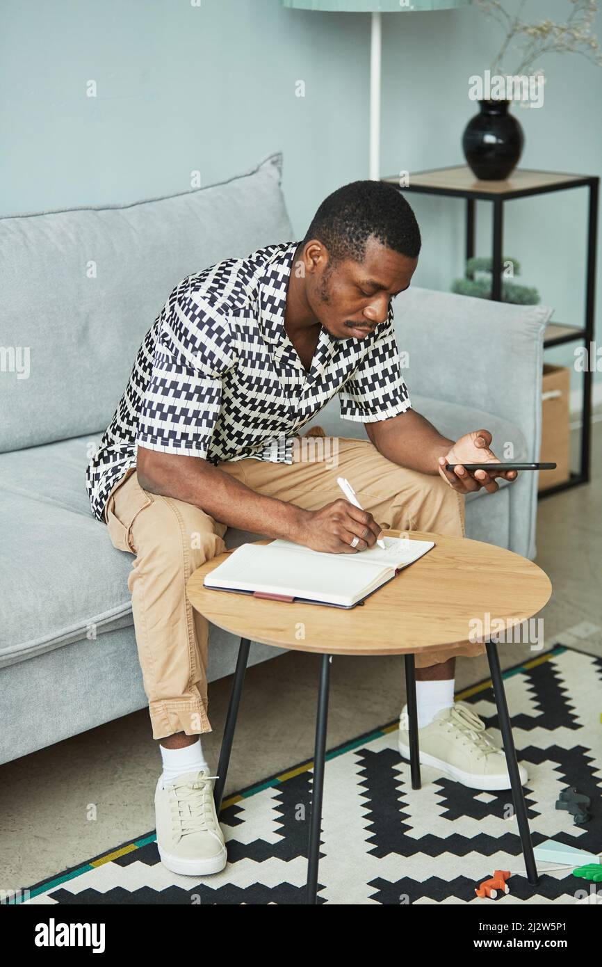 Black man studying in room hi-res stock photography and images - Alamy
