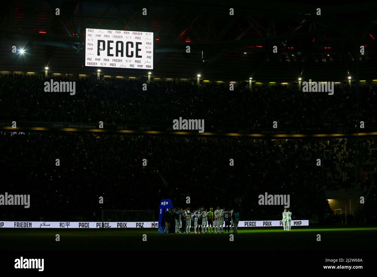 TURIN, ITALY - 03 APRIL 2022. Juventus and Internazionale players took the field with a special sash with the word 'Peace', to support a peaceful solution to the conflict in Ukraine. Before the big match, a Ukrainian and an Italian-Brazilian artist sang 'Imagine', John Lennon's famous pacifist song on April 03, 2022 at Allianz Stadium in Turin, Italy. Credit: Massimiliano Ferraro/Medialys Images/Alamy Live News Stock Photo