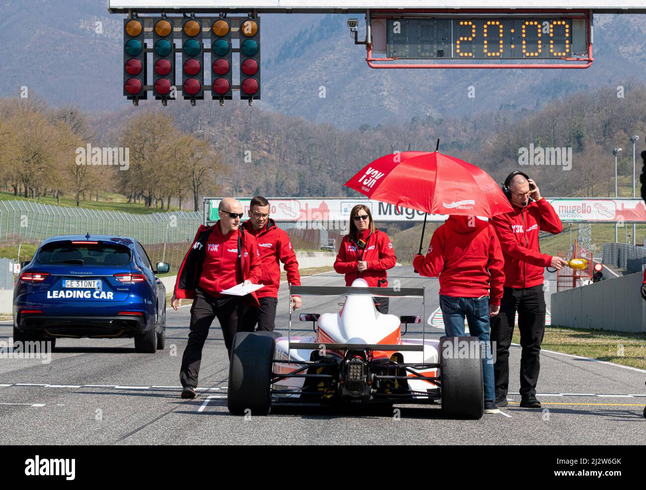 Single seater race car in pole position starting grid rear view on ...