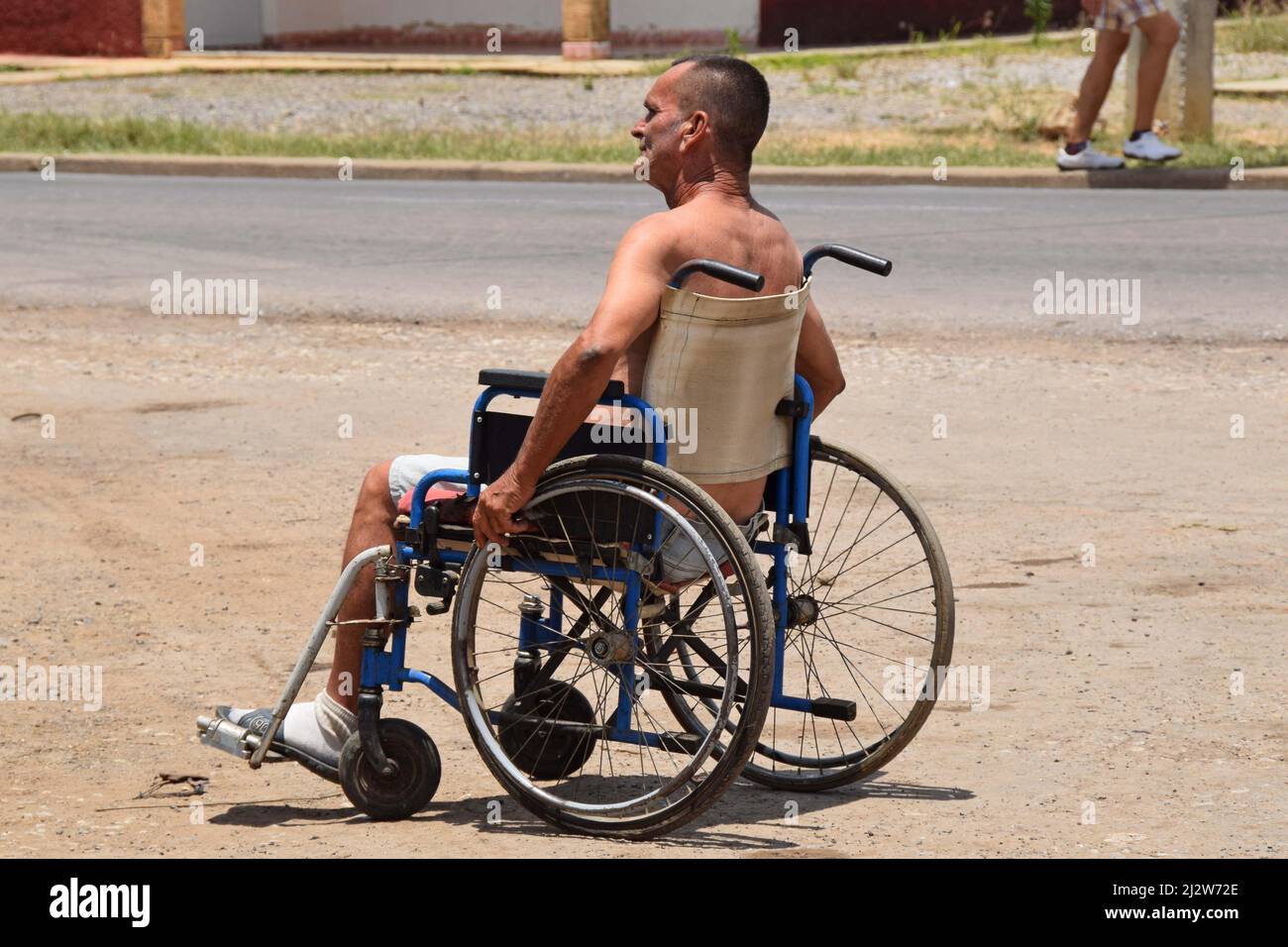 Disabled man in a wheelchair in Cuba Stock Photo