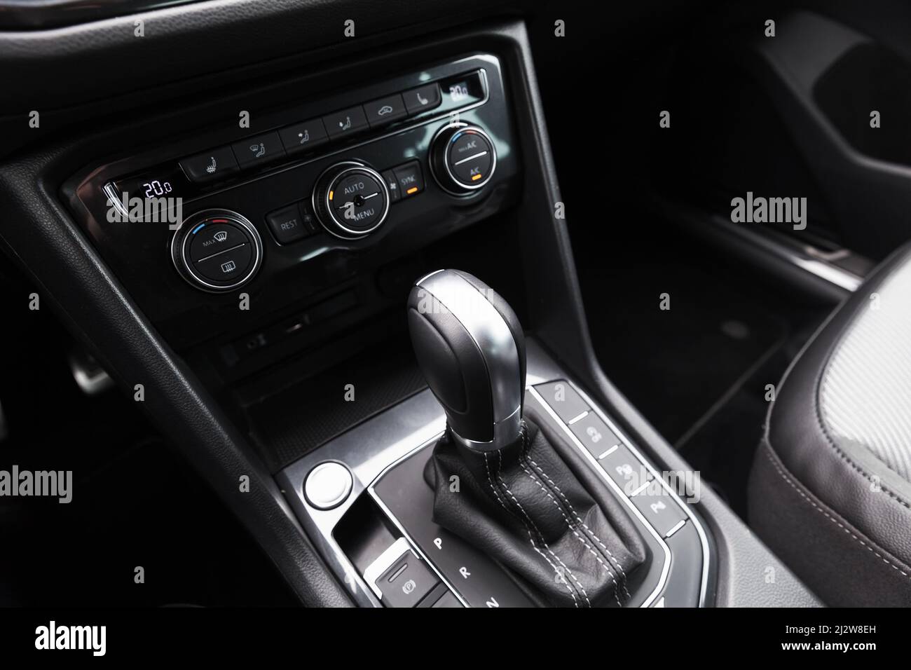 Gear lever and climate control panel of modern luxury crossover car. Close up photo with selective focus Stock Photo