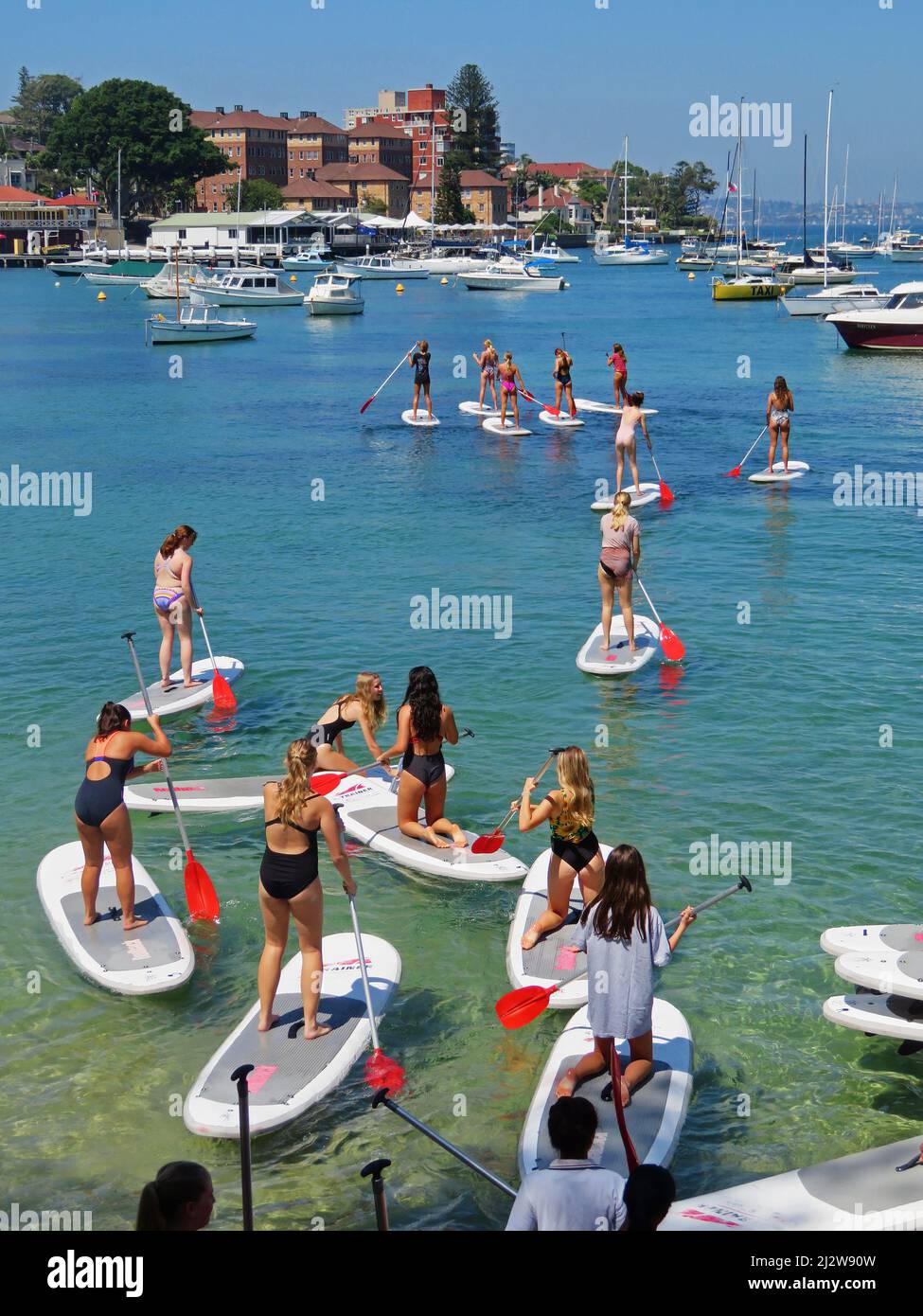 Australia, Sydney - Girls in Manly at a life guard training centre, busy with paddle boards. Stock Photo