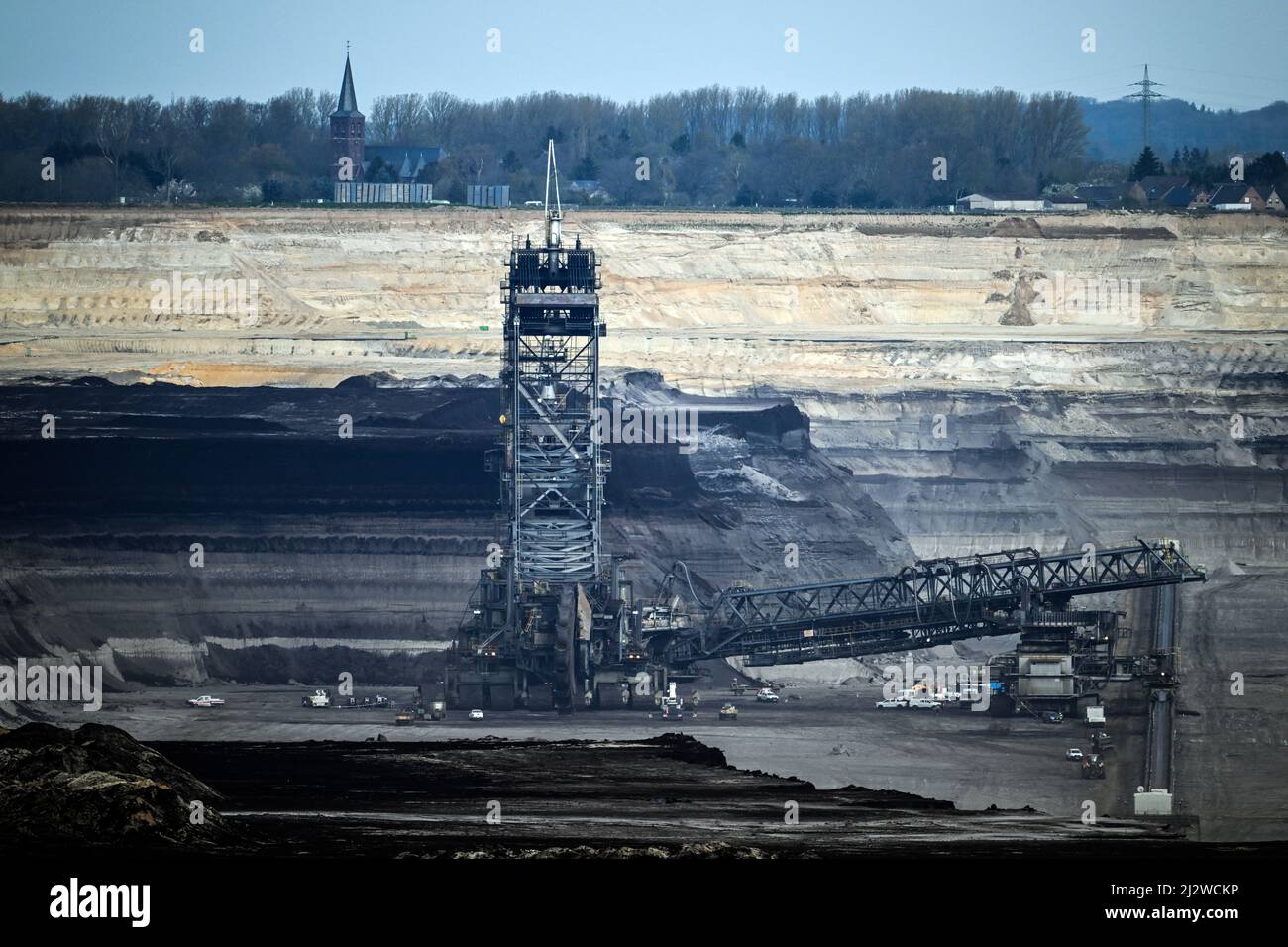 Jackerath, Germany. 04th Apr, 2022. Mining machines work in the Garzweiler open pit lignite mine. The Intergovernmental Panel on Climate Change will today present a comprehensive overview of how man-made climate change can be limited. The report reflects the current state of research on what measures are necessary and effective to curb global warming and avert climate catastrophe. Credit: Federico Gambarini/dpa/Alamy Live News Stock Photo