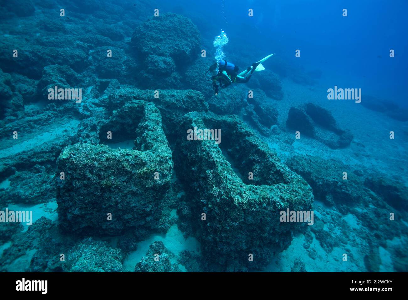 Scuba diver at sunken sarcophagi, Cape Gelydonia, Adrasan, Lykia, Turkey, Mediteranean sea Stock Photo