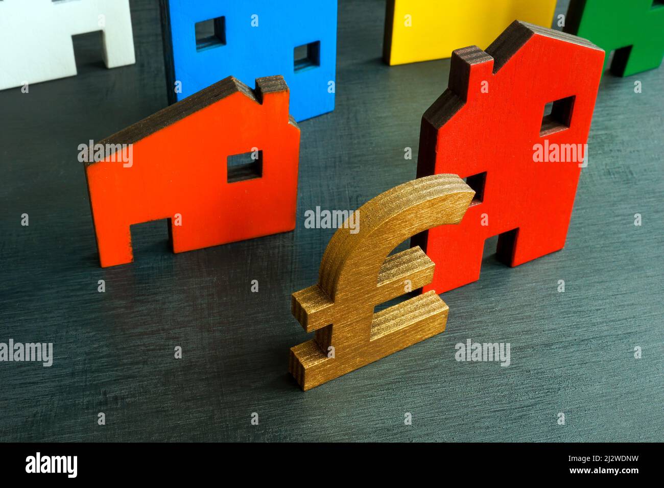 House models and British pound sign. BTL or buy to let mortgage. Stock Photo