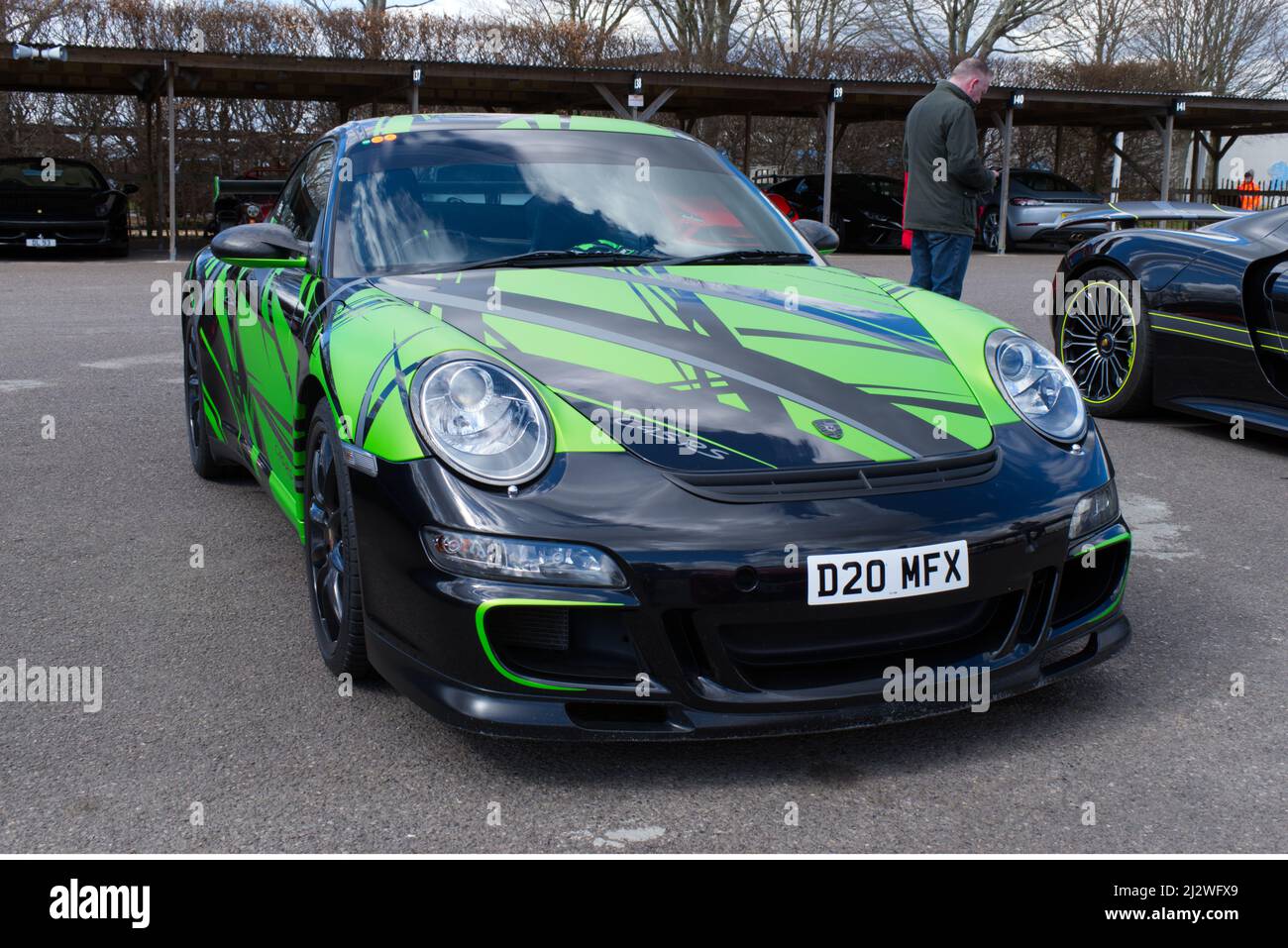 Porsche 911 In Distinctive Green And Black Colour In The Paddock Area porsche-911-in-distinctive-green-and-black-colour-in-the-paddock-area