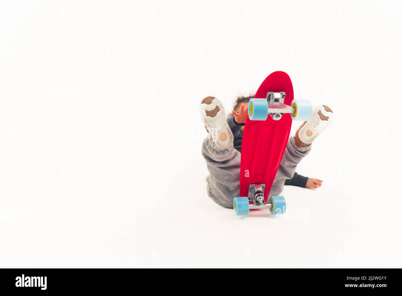 Ups Accidents happen little boy falls off red mini skateboard over