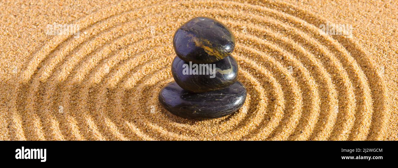 Japanese zen garden with yin and yang and feng shui in textured sand ...
