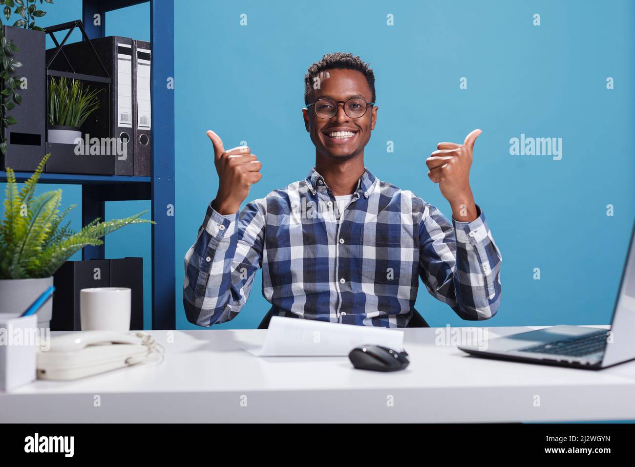 Research agency financial department boss giving thumbs up to hard