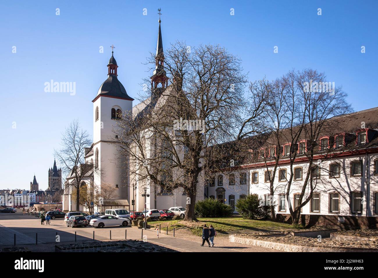 the church Alt St. Heribert in the district Deutz, view across the Rhine to the old part of the town with church Gross St. Martin, Cologne, Germany. K Stock Photo