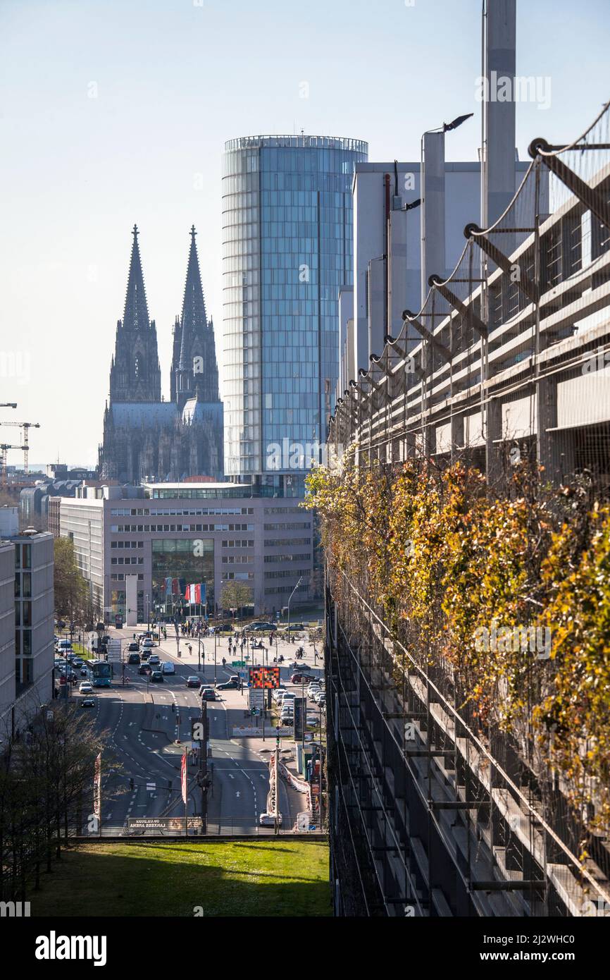 view to the cathedral and the Cologne TriangleTower in the district Deutz, on the right a green facade of a parking garage at the Lanxess Arena, Colog Stock Photo