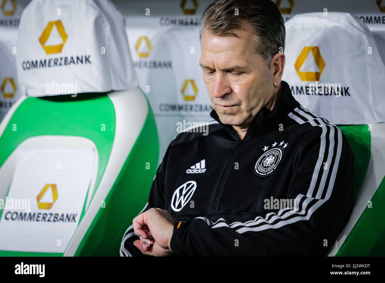 Wolfsburg, Germany, March 20, 2019: German national team head coach assistant watches the time during the international soccer game Germany vs Serbia Stock Photo