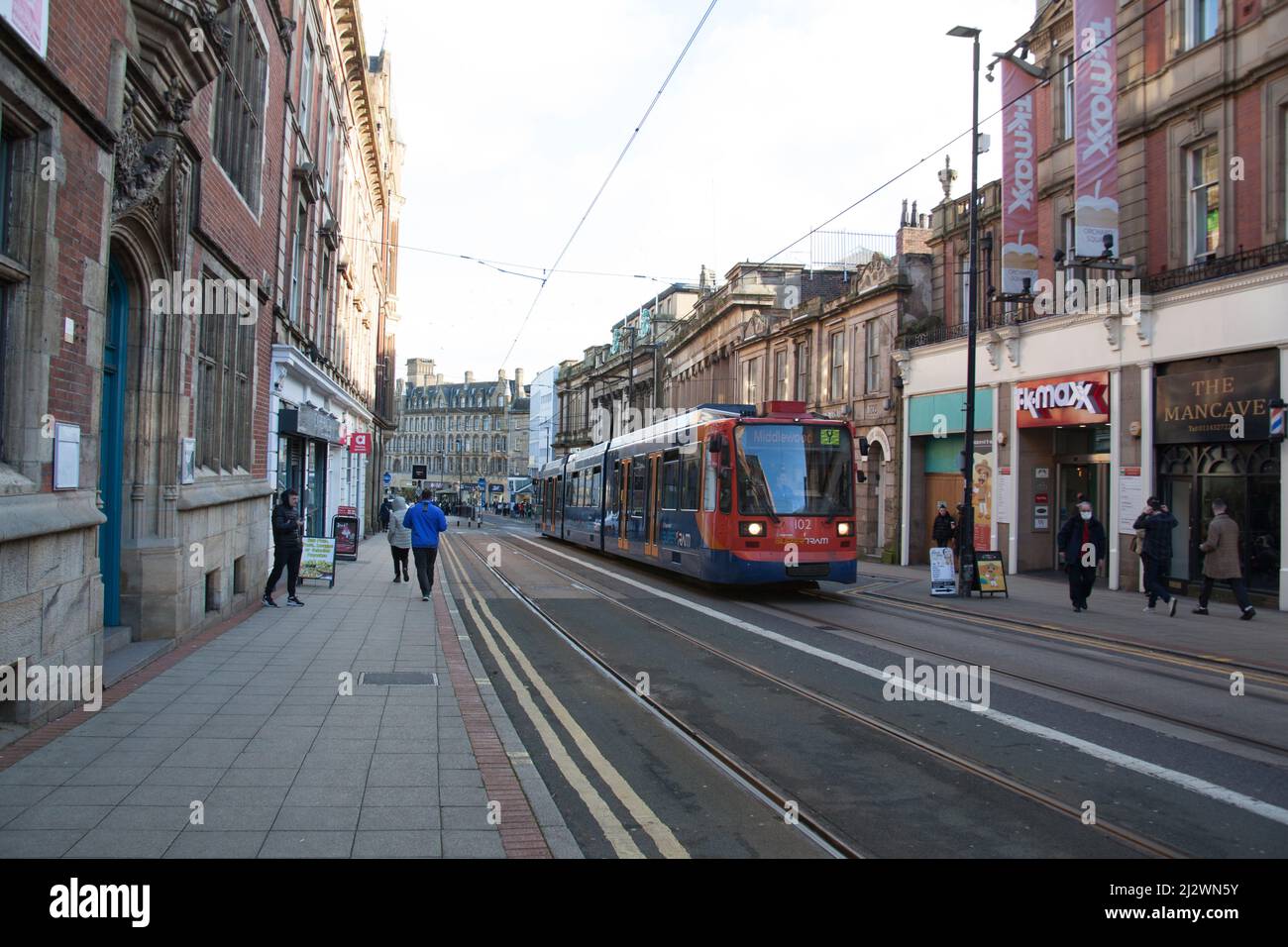 A tram on Church Street in Sheffield in the UK Stock Photo
