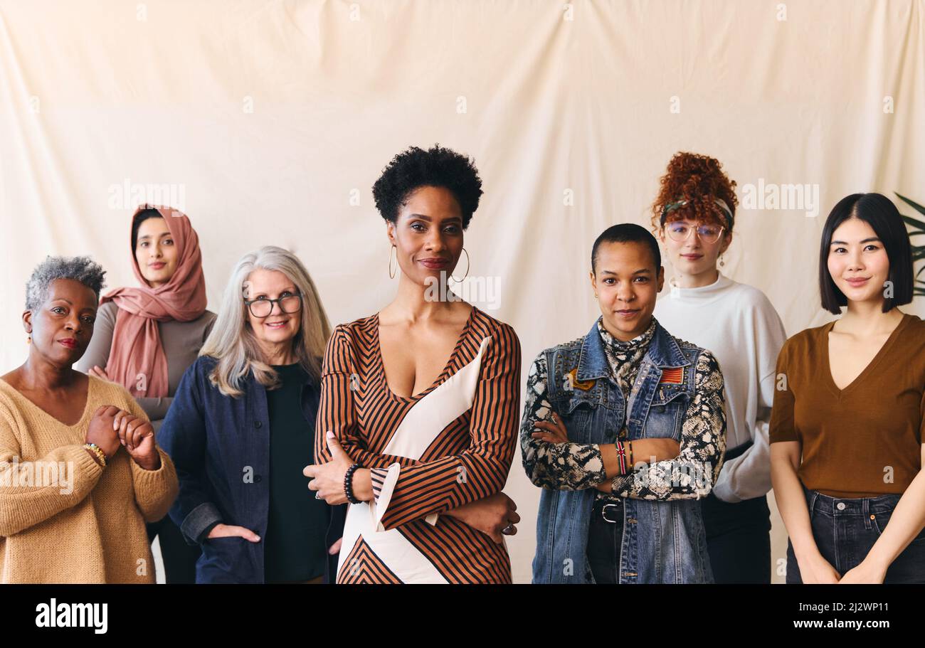 International Women's Day portrait of confident multiethnic mixed age range women looking towards camera Stock Photo