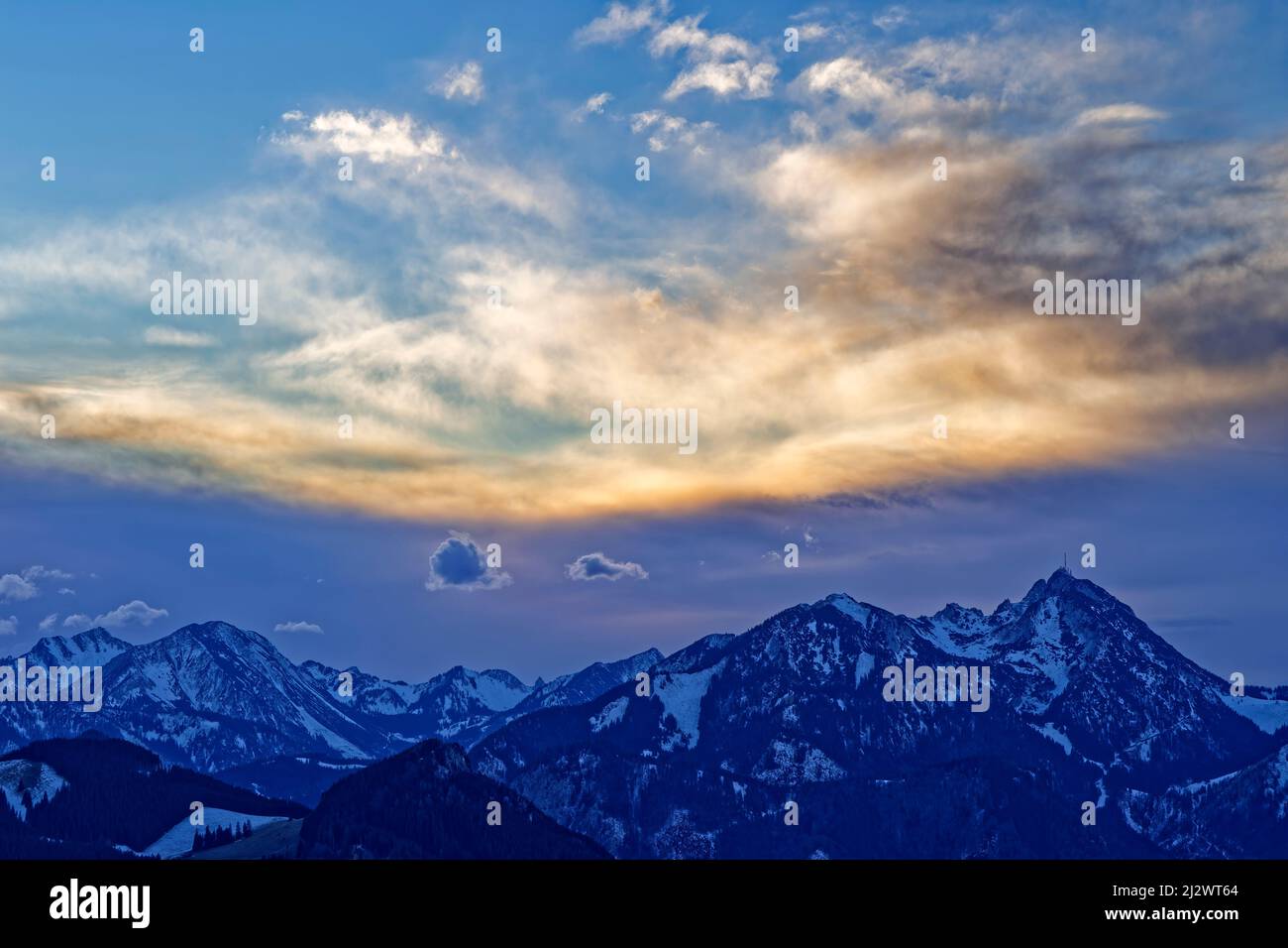 Evening cloud mood over the Spitzing area and Wendelstein, from the Heuberg, Chiemgau Alps, Upper Bavaria, Bavaria, Germany Stock Photo