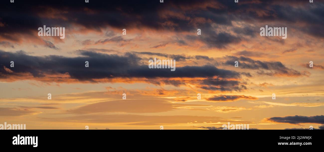 Sunset sky with orange clouds. Nature background Stock Photo - Alamy