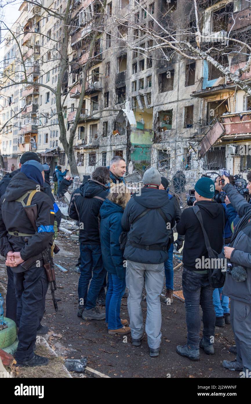 Kiev, Ukraine - March 14, 2022: Destruction of an apartment building in Kyiv, Ukraine. Vitali Klitschko, the mayor of besieged Kyiv, gives an intervie Stock Photo
