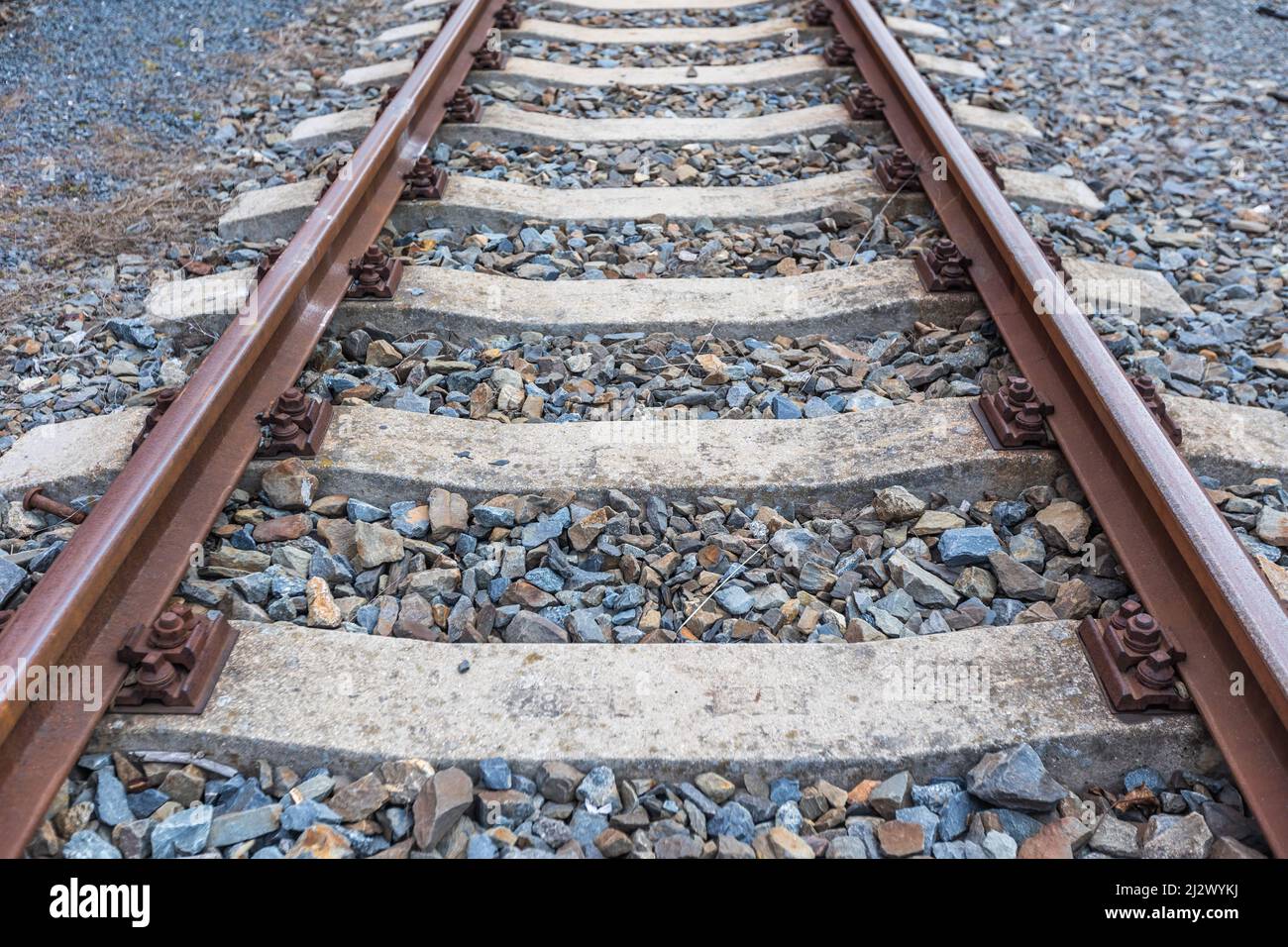 A railway tracks, gravel and screws, transport concept Stock Photo