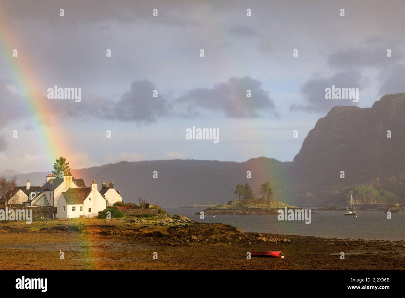 Rainbow over Plockton at low tide, Loch Carron, Western Ross, Highlands, Scotland UK Stock Photo