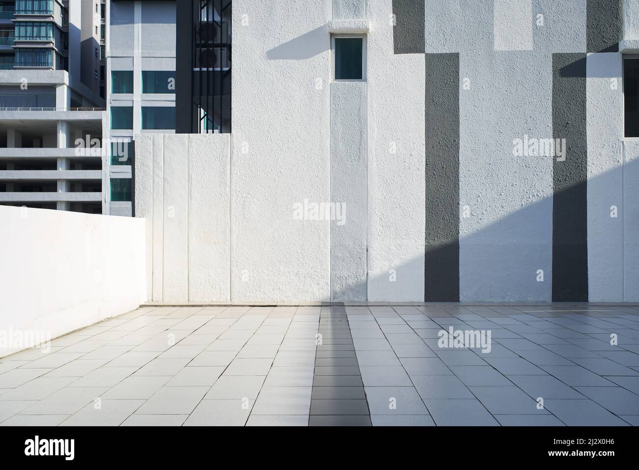 Empty floor with wall in white, grey and black stripes design Stock Photo