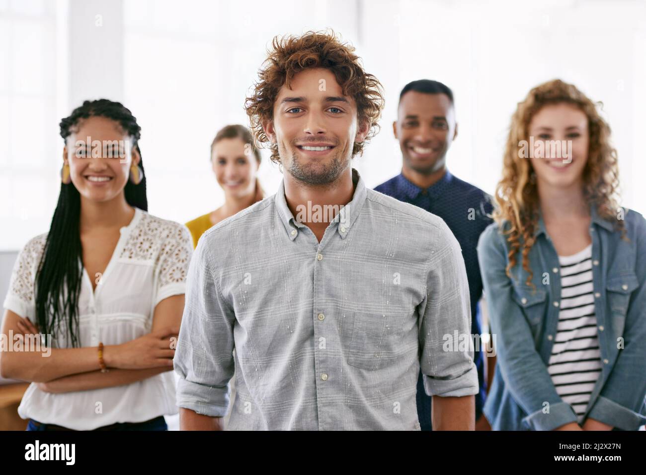 Confident in their abilities. Cropped portrait of a group of young coworkers standing in a brightly lit office. Stock Photo