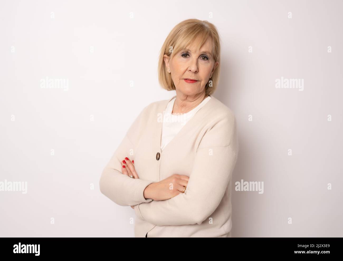 Middle aged woman arms crossed hi-res stock photography and images - Alamy