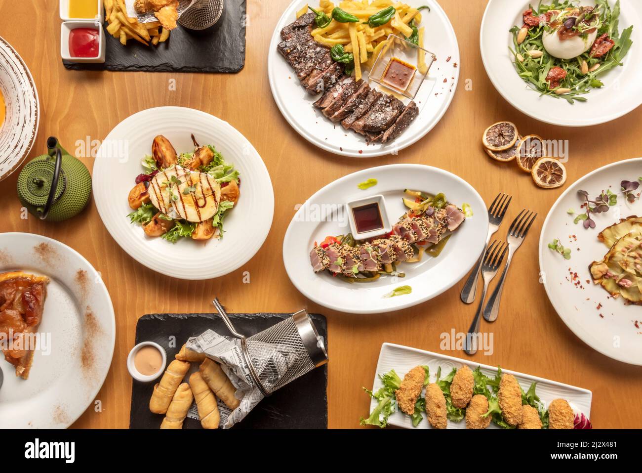 Set of varied international food dishes, with Venezuelan tequeños