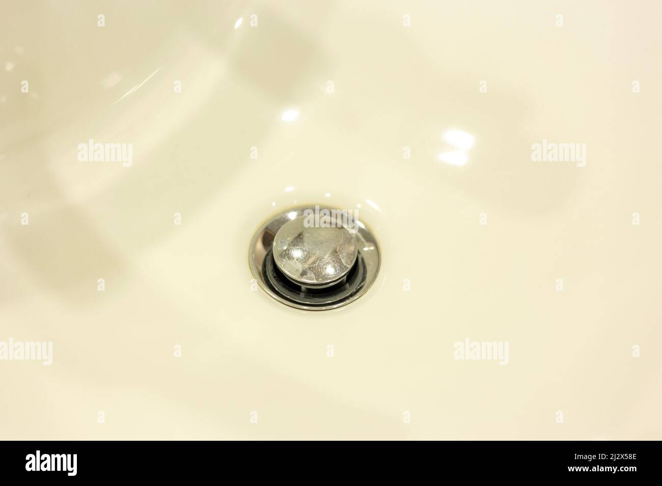 Drain hole in a white tub. Bathroom Stock Photo Alamy