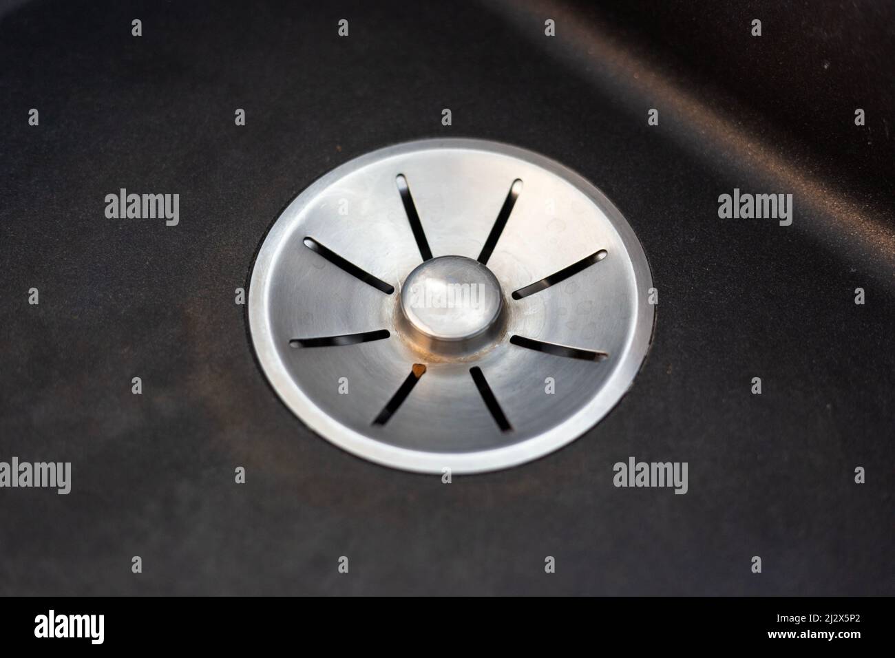 Silver drain hole in the kitchen sink Stock Photo Alamy