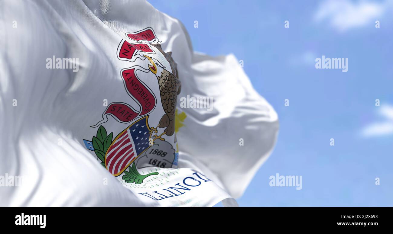 The US state flag of Illinois waving in the wind. Illinois is a state in the Midwestern region of the United States. Democracy and independence. Stock Photo