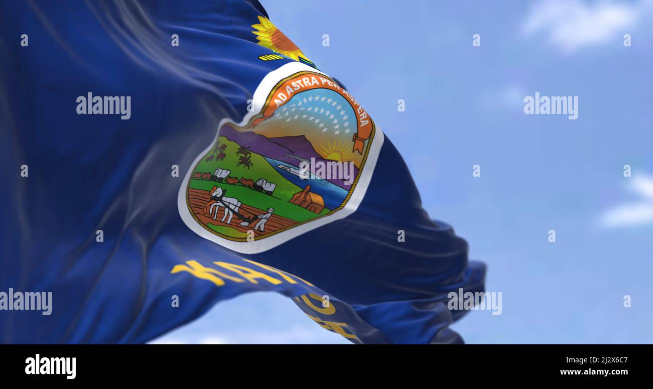The US state flag of Kansas waving in the wind. Kansas is a state in the Midwestern United States. Democracy and independence. Stock Photo