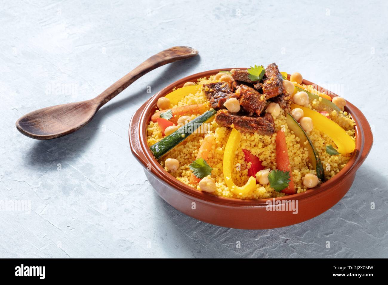 Couscous with meat and vegetables, festive Moroccan dinner, a dish of