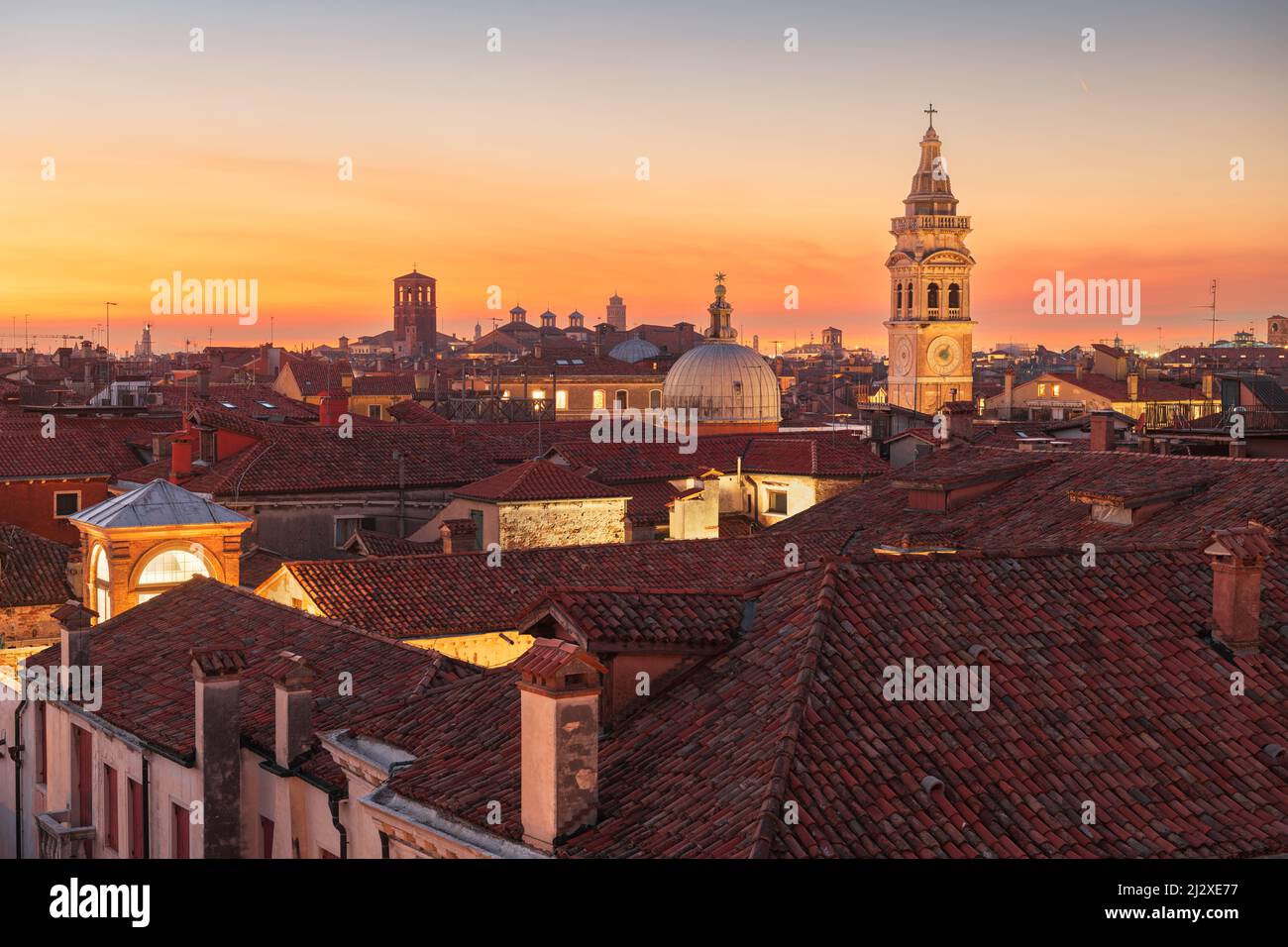 Venice, Italy rooftop skyline and historic landmarks at dusk. Stock Photo