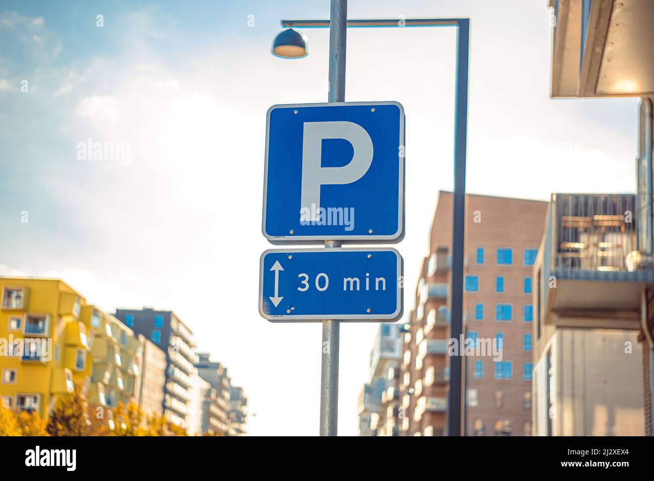 Road sign allowing parking for 30 minutes in a developing city area in