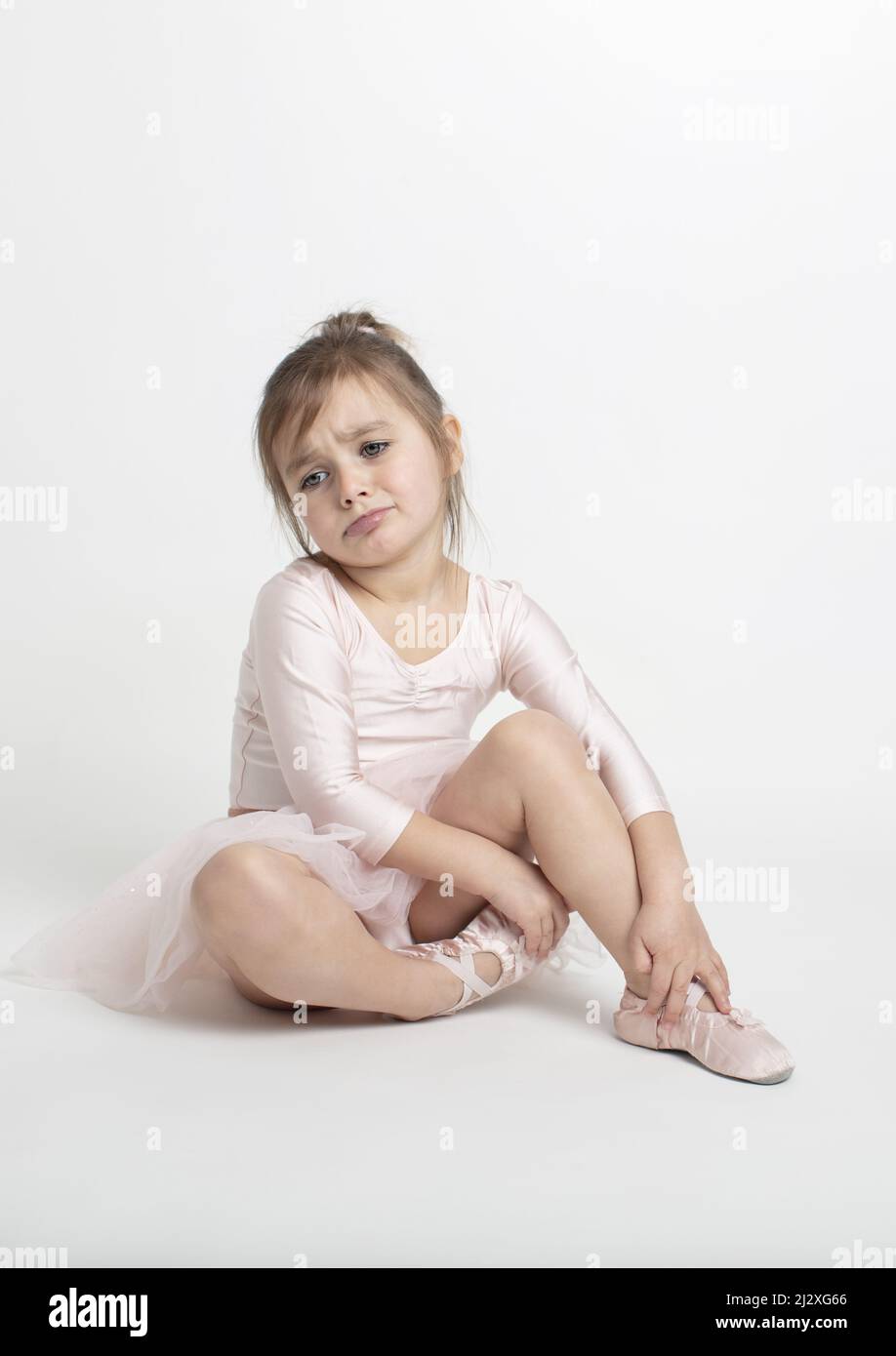 Little ballerina looking a bit annoyed and tired from her practice in