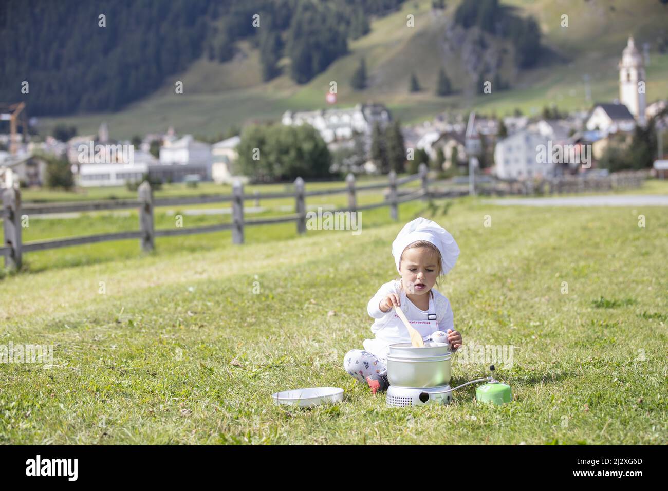 Little child in cooking pot hi-res stock photography and images - Alamy