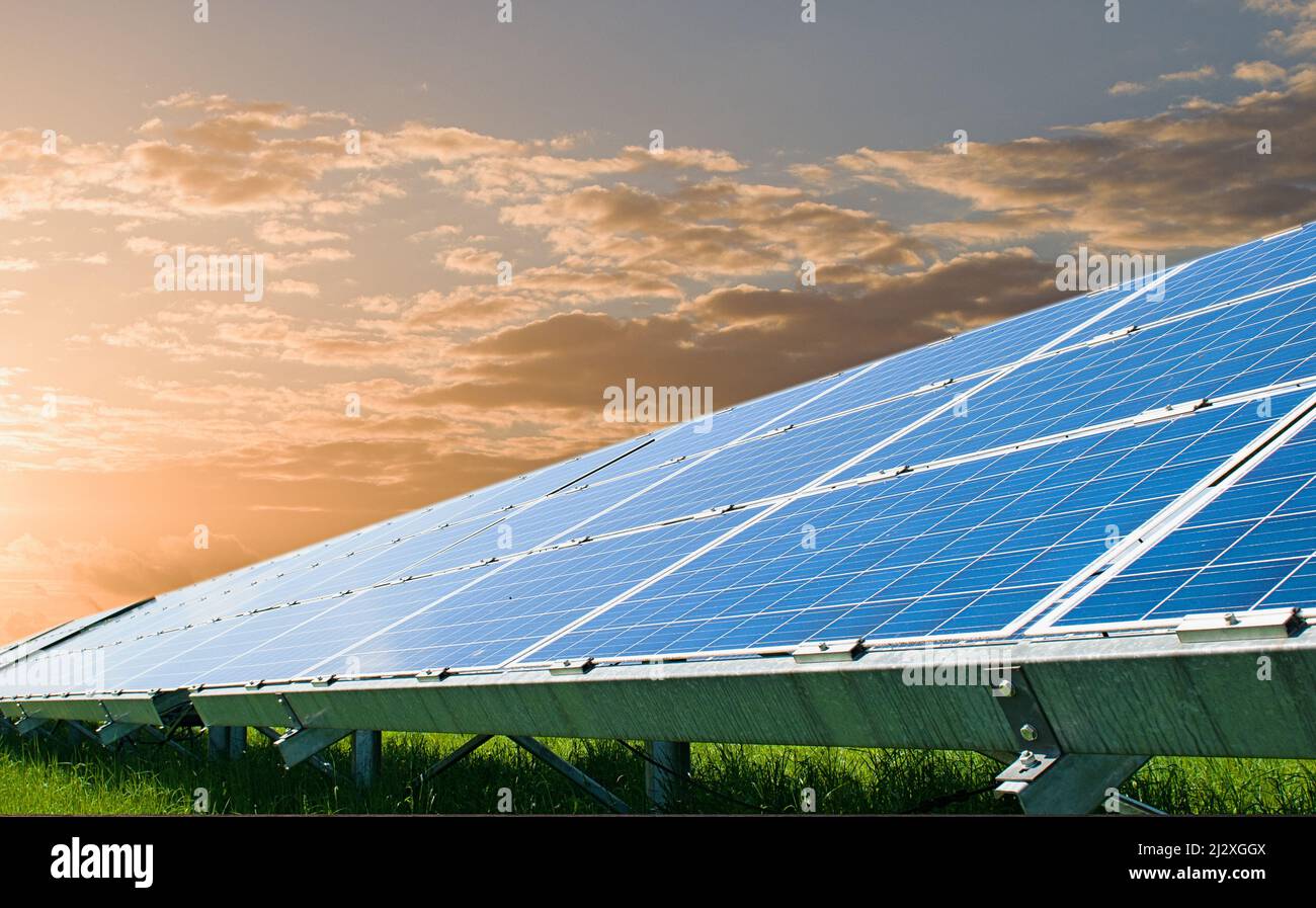 Sun rays over a photovoltaic power plant Stock Photo