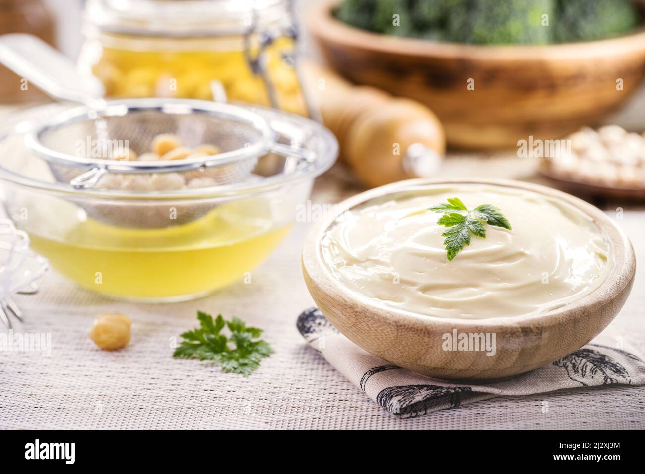 Vegan mayonnaise made from chickpeas and legemus, with a jar of
