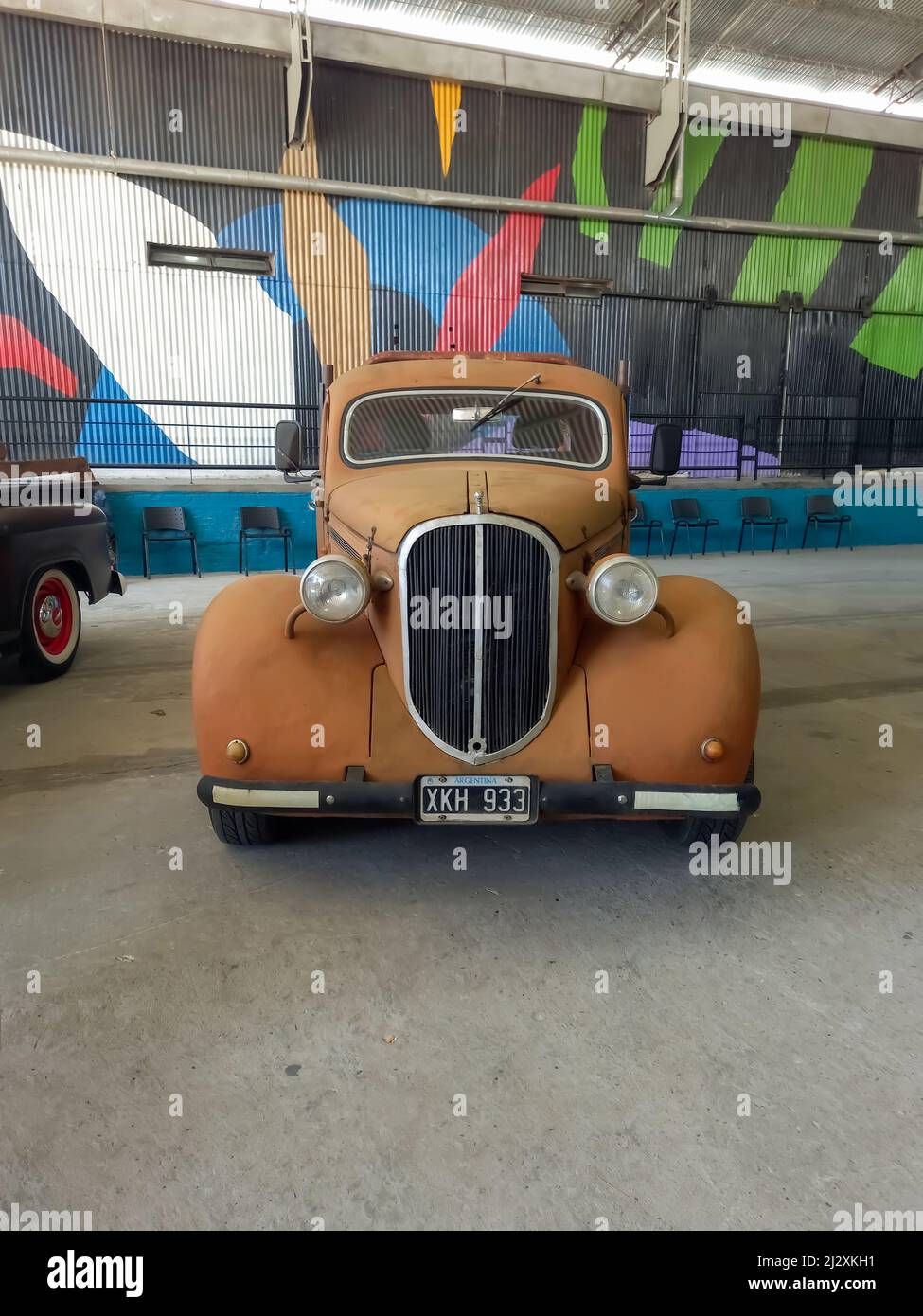 Moron, Argentina - Mar 26, 2022 - old rusty unpainted Chrysler Dodge 1930s parked in a warehouse yard. Front view. Classic car show. Copyspace Stock Photo