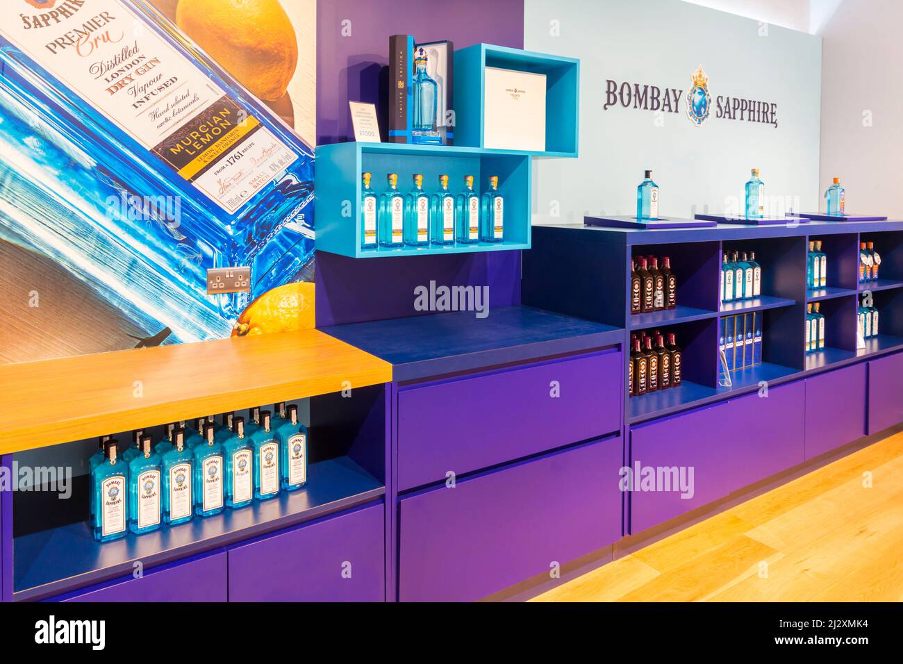 Bottles of Bombay Sapphire gin for sale on display in Gin Shop at Bombay Sapphire Gin Distillery, Laverstoke Mill, Laverstoke, Hampshire, UK in March Stock Photo