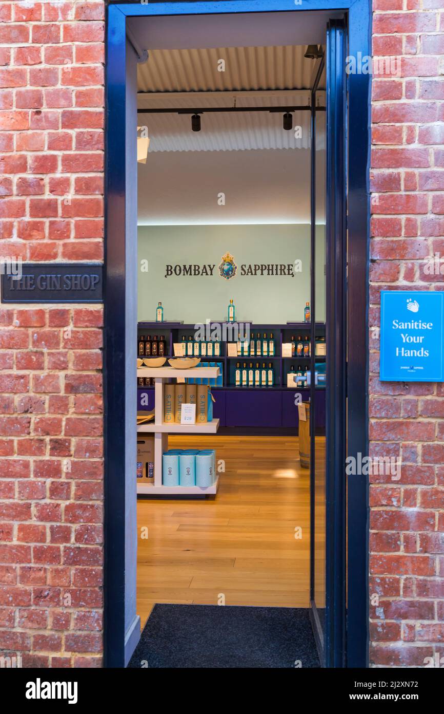 Entrance to the Gin Shop at Bombay Sapphire Gin Distillery, Laverstoke Mill, Laverstoke, Hampshire, UK in March with Sanitise Your Hands notice Stock Photo