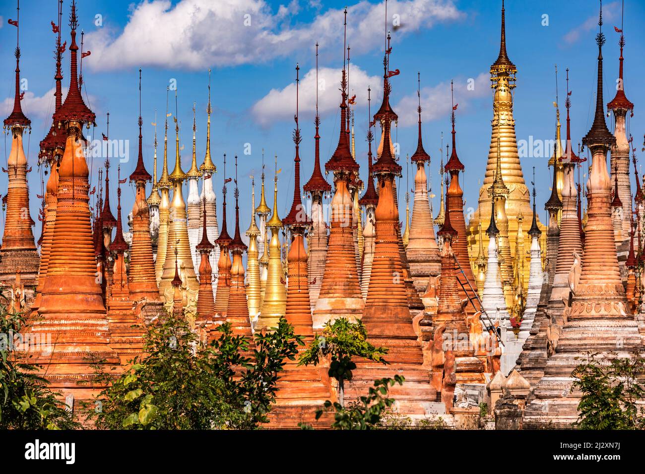 A multitude of grave stupas standing close together in the pagoda forest of In-Dein on Inle Lake in Myanmar Stock Photo