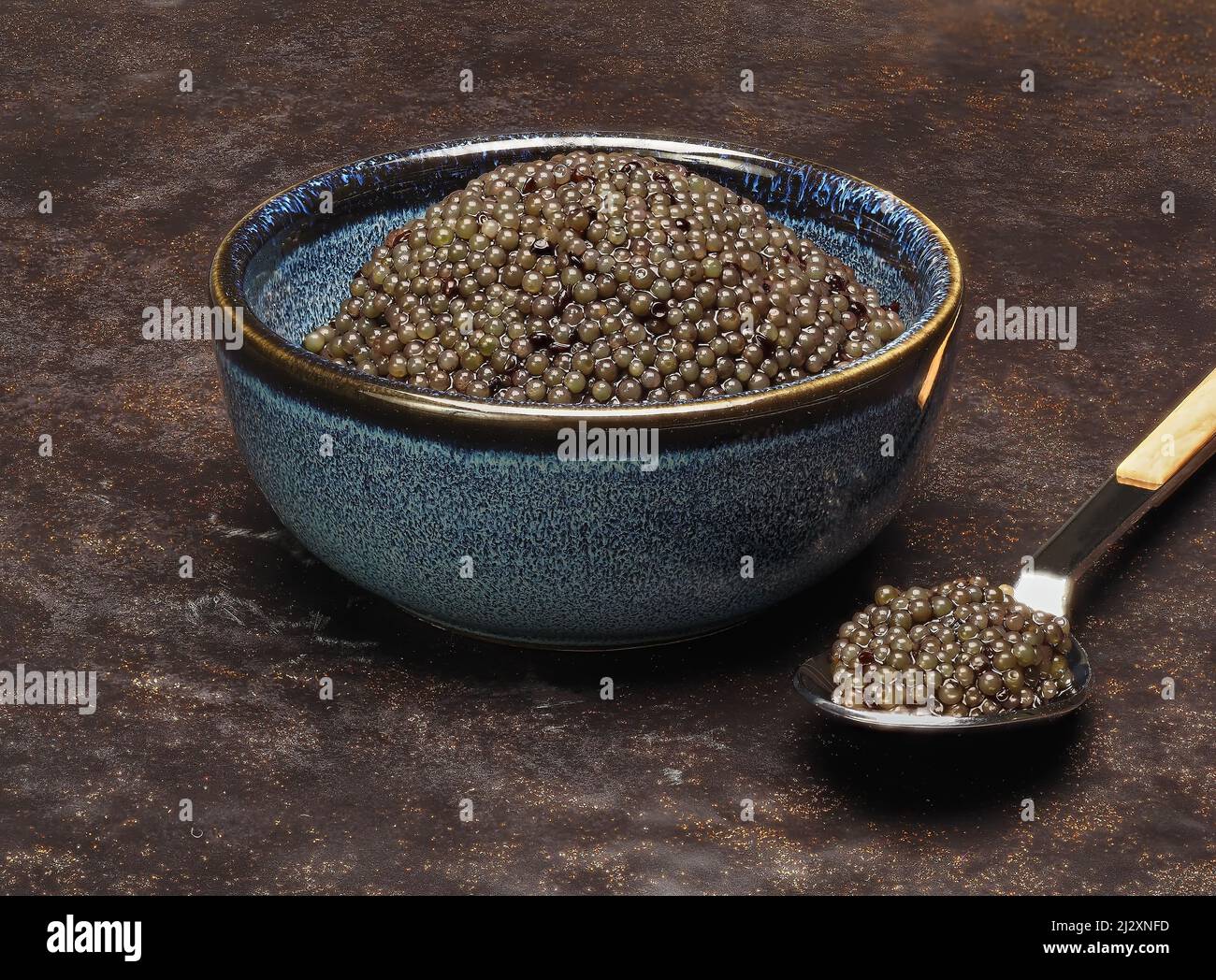 Black lumpfish roe - eggs of lumpfish colored black to imitate caviar Stock Photo