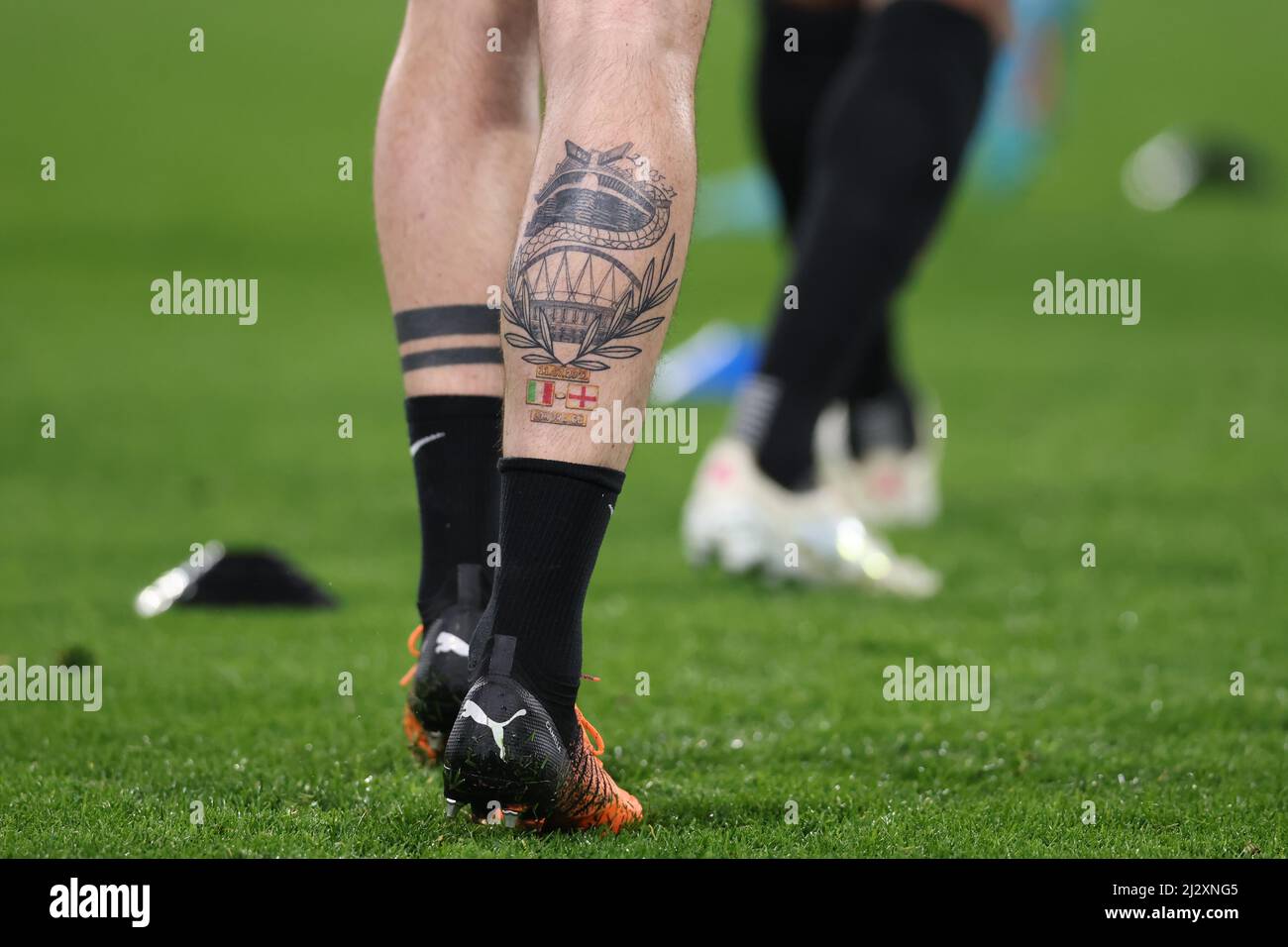 Turin, Italy, 3rd April 2022. A tattoo on the calf of Alessandro Bastoni of FC Internazionale bearing an image of the San Siro Stadium to celebrate the scudetto victory in 2021 and Wembley stadium to celebrate the EURO2020 title in 2021during the warm up prior to the Serie A match at Allianz Stadium, Turin. Picture credit should read: Jonathan Moscrop / Sportimage Credit: Sportimage/Alamy Live News Stock Photo