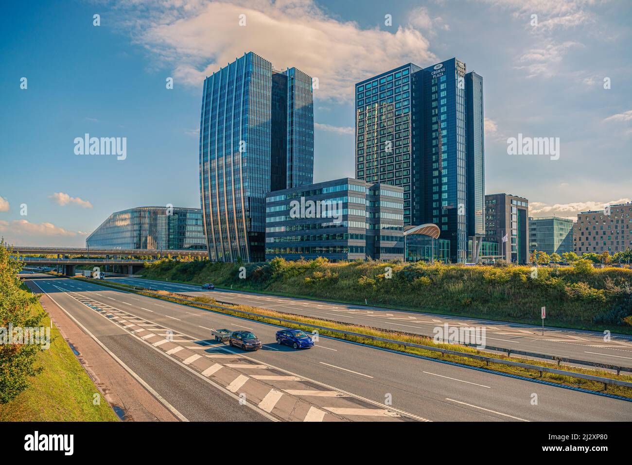 Crowne Plaza Copenhagen Towers hotel and Øresundsmotorvejen highway in Ørestad, Copenhagen, Denmark Stock Photo