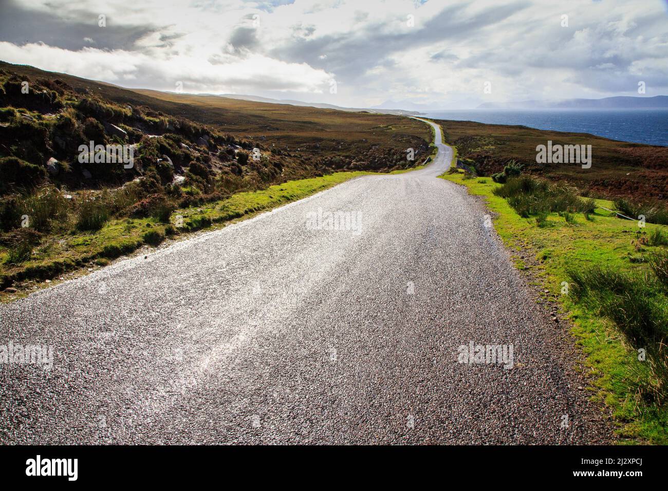 Lonely empty country road along the Applecross coast, single track, Wester Ross, Scotland UK Stock Photo