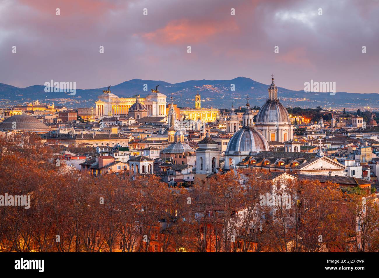 Rome, Italy historic skyline at dusk with autumn foliage. Stock Photo