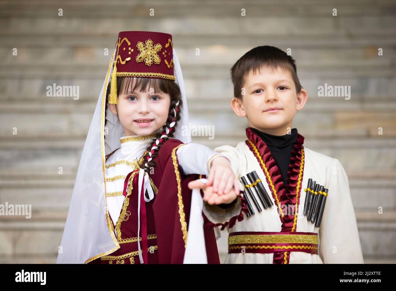 A boy and a girl in national Georgian clothes Stock Photo - Alamy