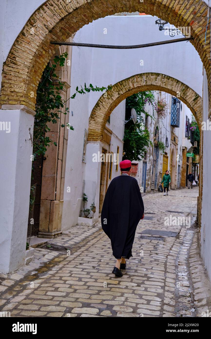 Tunisia, Tunis, Medina listed as World Heritage by Unesco, man in traditional dress Stock Photo